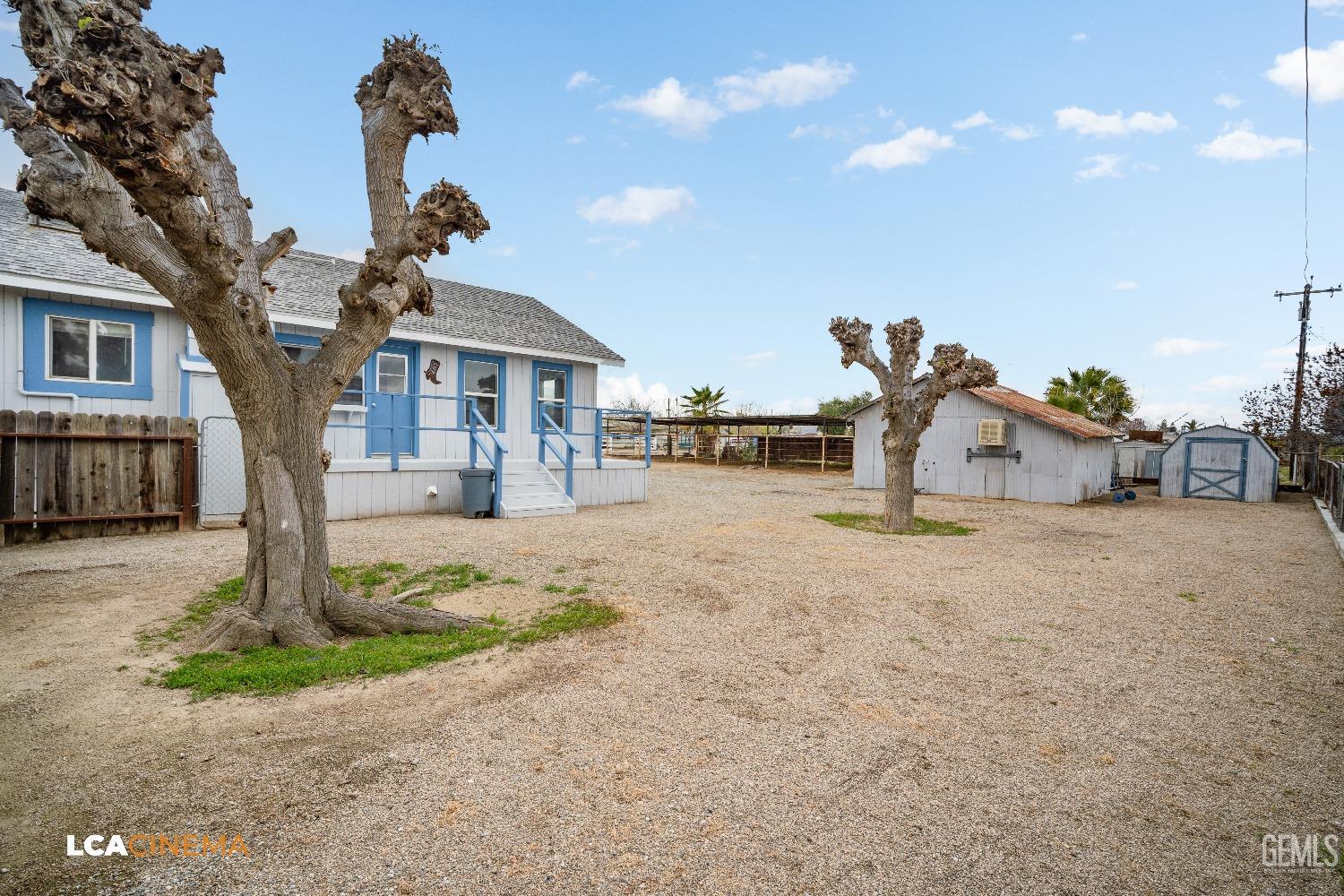 Undisclosed Address Taft, CA 93268 - Photo 8 of 28 a front view of a house with a yard