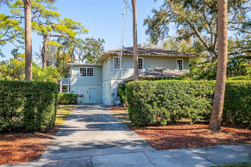 5013 Bay Shore Road Sarasota, FL 34234 - Photo 2 of 22 front view of a house with a yard