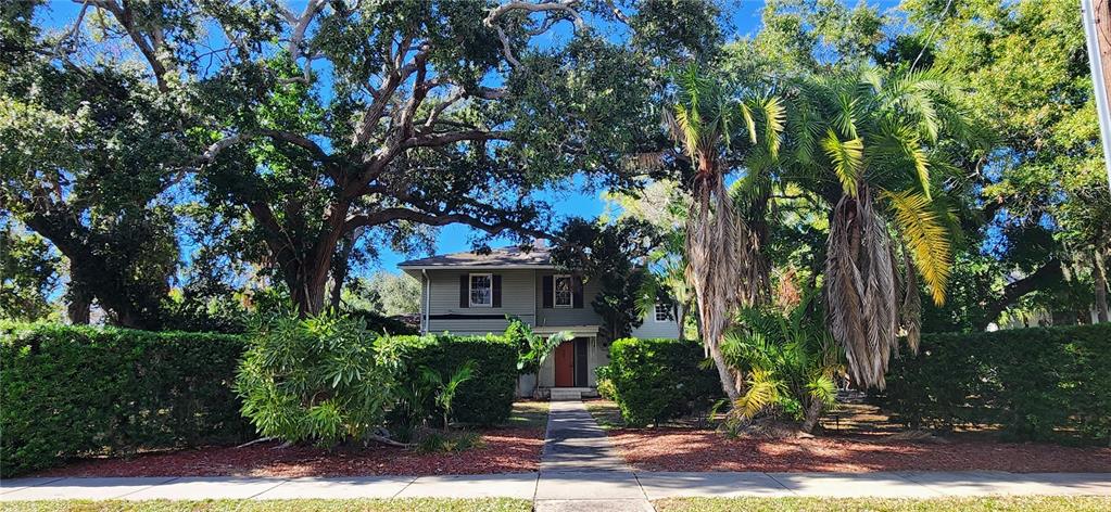 5013 Bay Shore Road Sarasota, FL 34234 - Photo 21 of 22 a front view of a house with garden