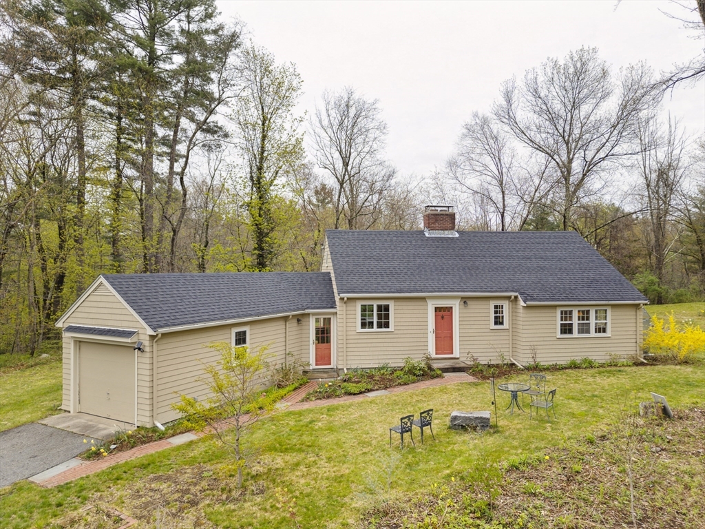 64 Trapelo Road Lincoln, MA 01773 - Photo 1 of 33 a front view of a house with a yard
