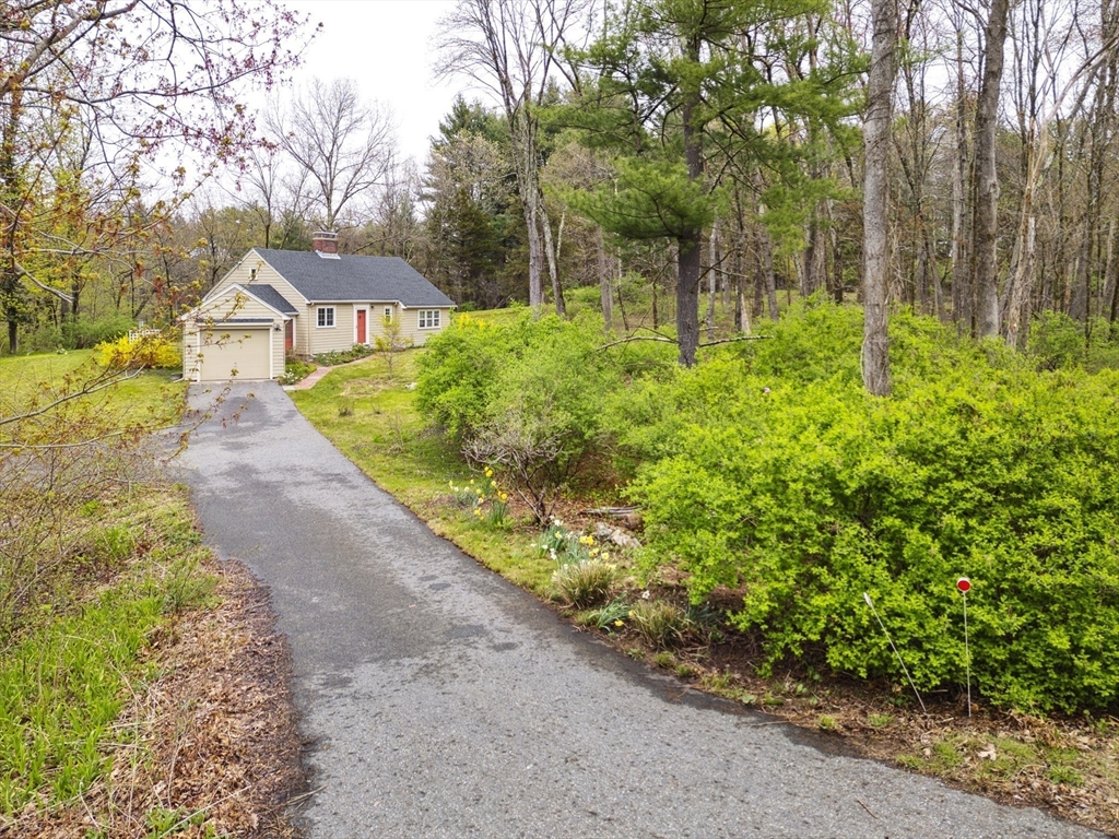 64 Trapelo Road Lincoln, MA 01773 - Photo 2 of 33 a backyard of a house with lots of green space