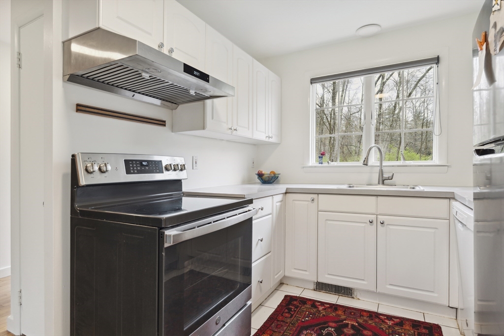 64 Trapelo Road Lincoln, MA 01773 - Photo 21 of 33 a kitchen with a sink stove and cabinets