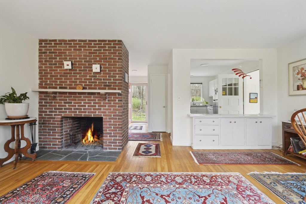 64 Trapelo Road Lincoln, MA 01773 - Photo 9 of 33 a living room with furniture rug and fireplace