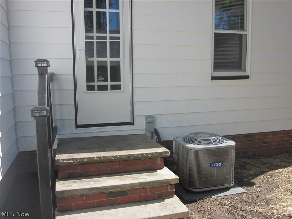 1810 Lorimer Road Cleveland, OH 44134 - Photo 44 of 47 Doorway to property featuring central AC unit