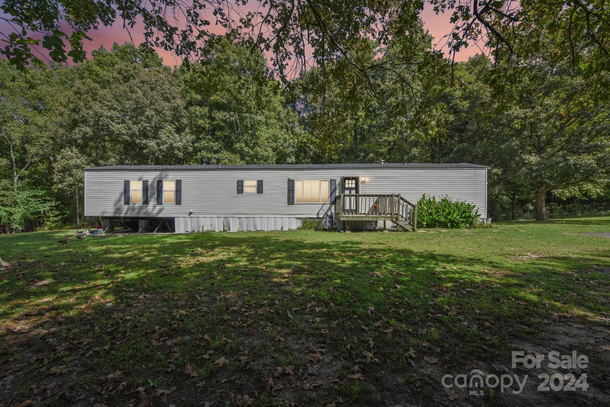 220 Yarbro Road Kings Mountain, NC 28086 - Photo 1 of 38 a view of house with backyard and garden