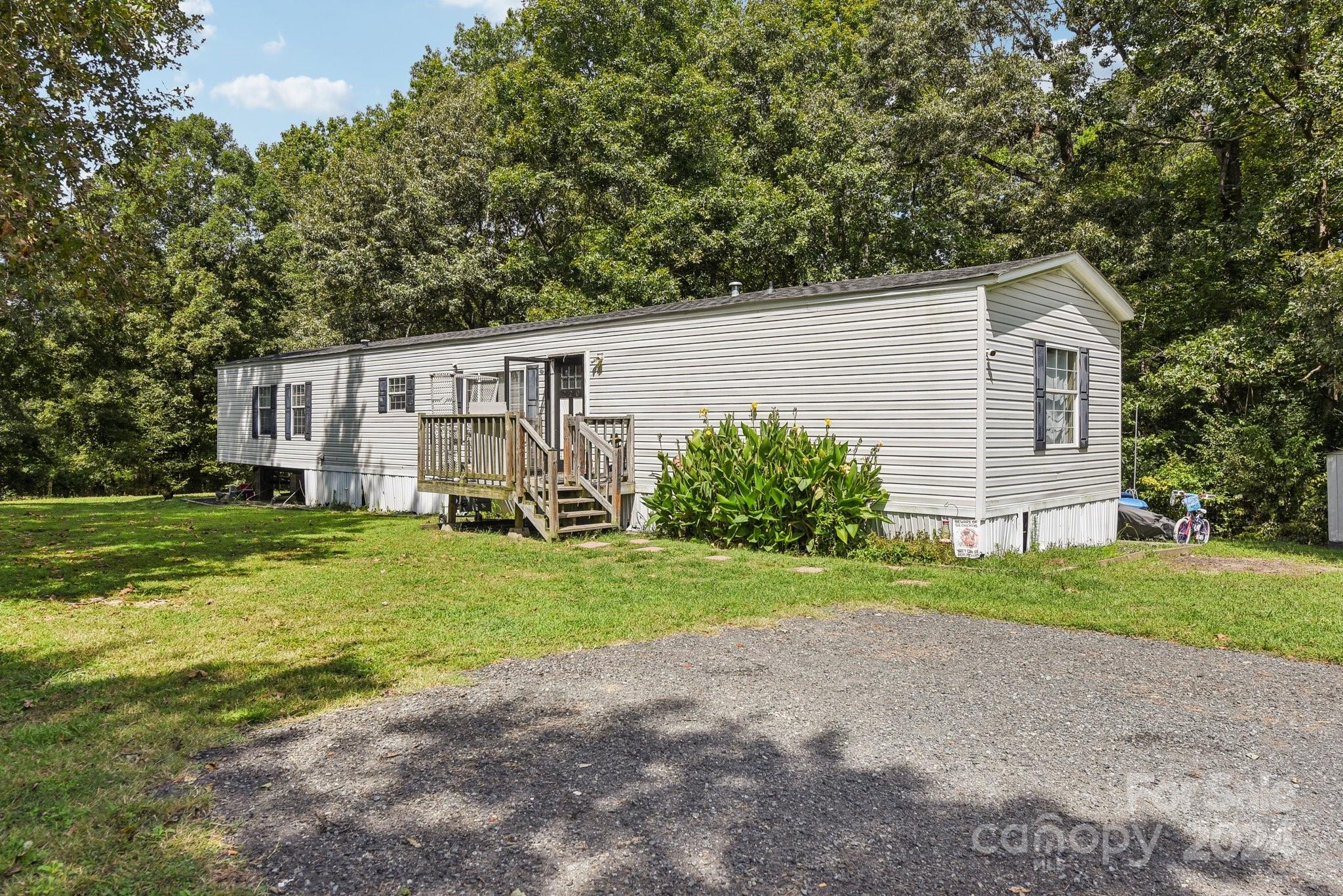 220 Yarbro Road Kings Mountain, NC 28086 - Photo 2 of 38 a view of a house with backyard and garden
