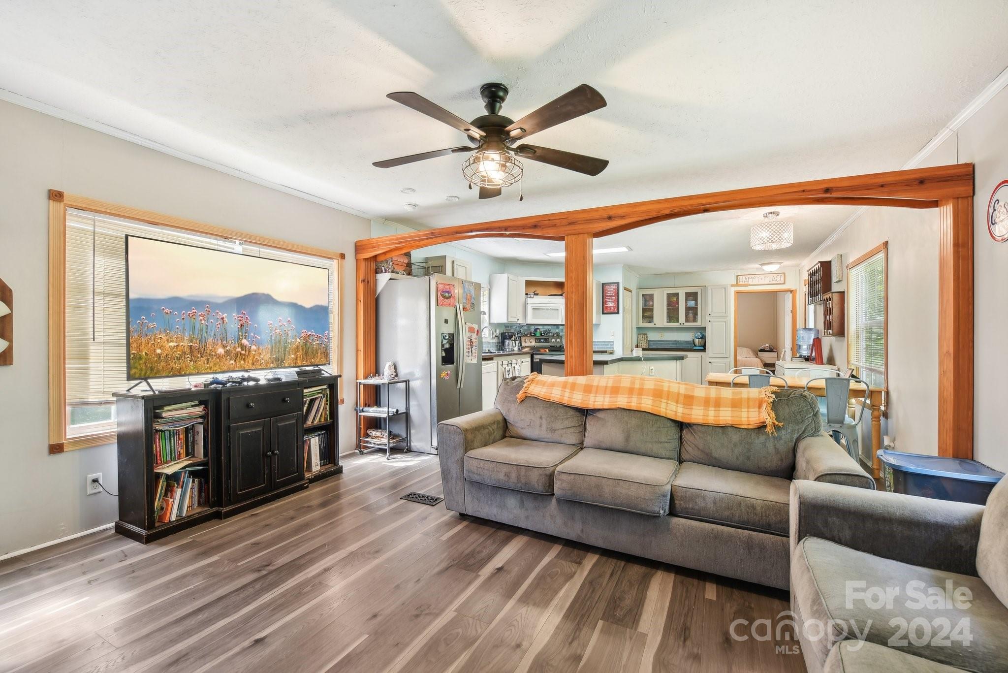 220 Yarbro Road Kings Mountain, NC 28086 - Photo 25 of 38 a living room with furniture floor to ceiling window and a kitchen view