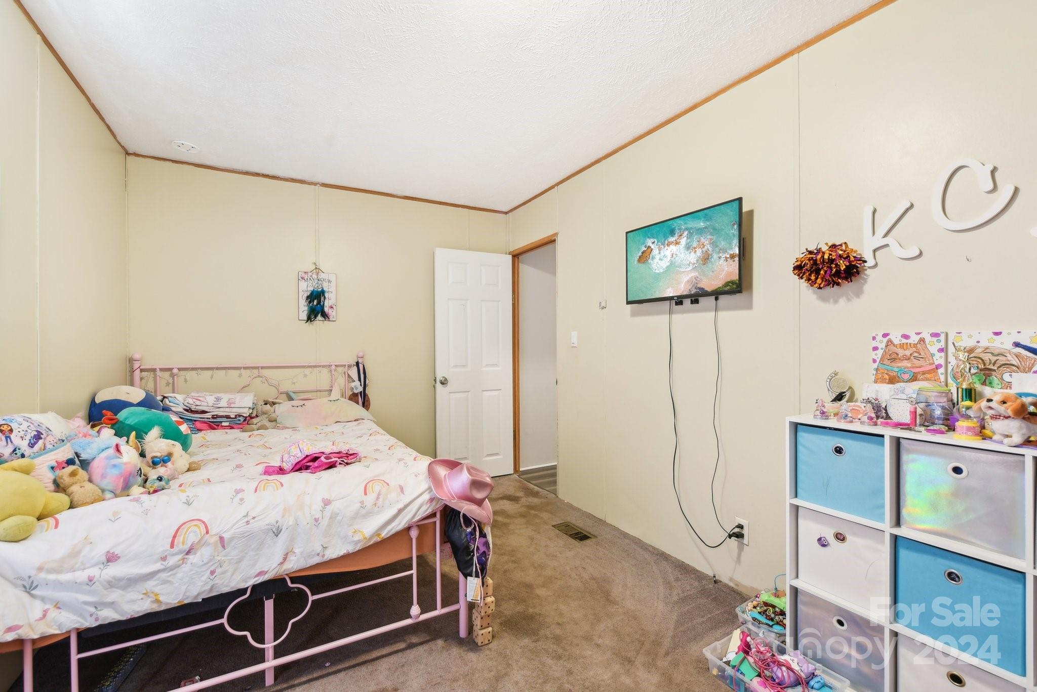 220 Yarbro Road Kings Mountain, NC 28086 - Photo 29 of 38 a bedroom with a bed and a table in it