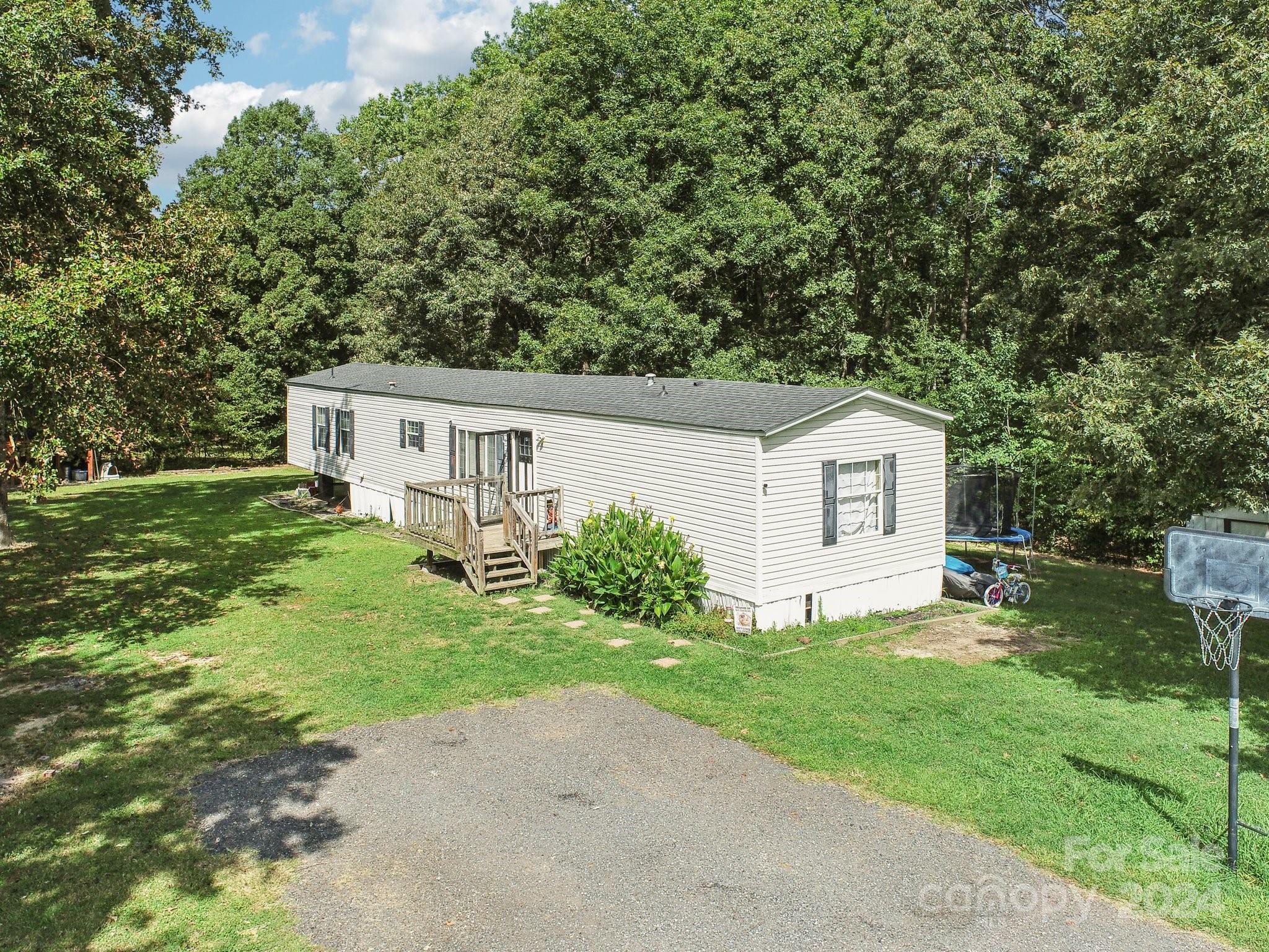 220 Yarbro Road Kings Mountain, NC 28086 - Photo 3 of 38 a view of a house with backyard and a tree