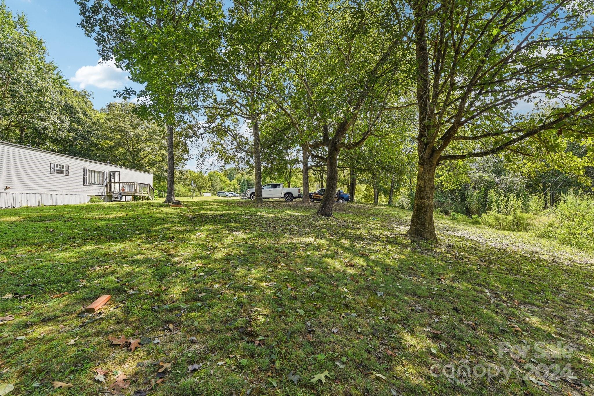 220 Yarbro Road Kings Mountain, NC 28086 - Photo 4 of 38 a big yard with lots of green space and trees