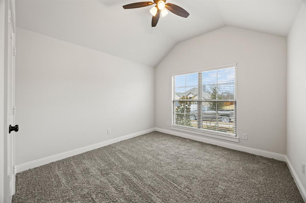 104 Maverick Trail Valley View, TX 76272 - Photo 21 of 30 an empty room with chandelier fan