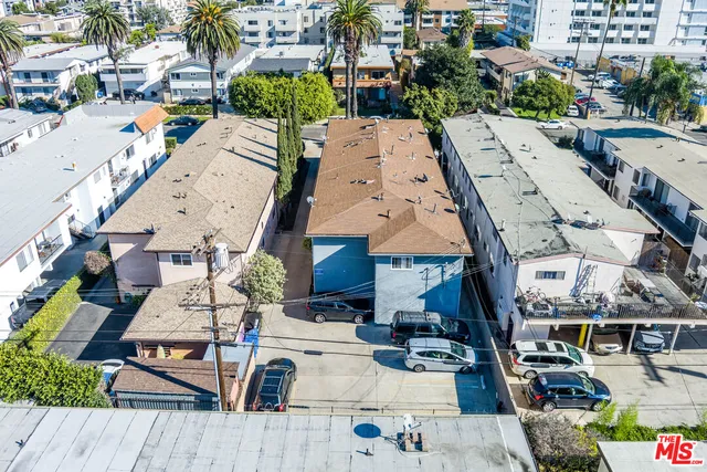 an aerial view of a house with wooden floor