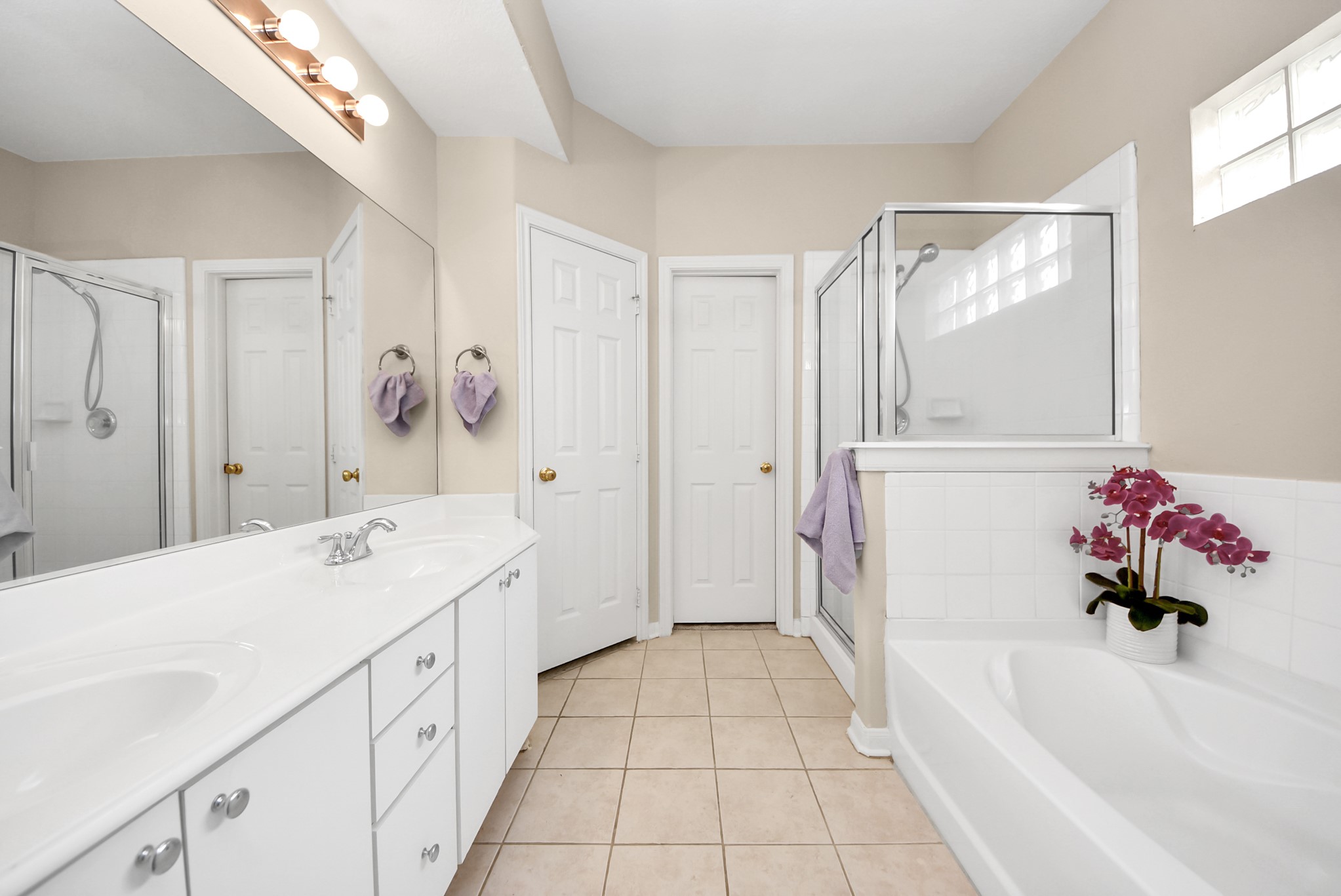 18963 Candlelight Crescent Road Spring, TX 77388 - Photo 20 of 33 Master bath with separate stand-up shower and relaxing soaking tub. Imagine a spa-like retreat feel at the comfort of your own home.