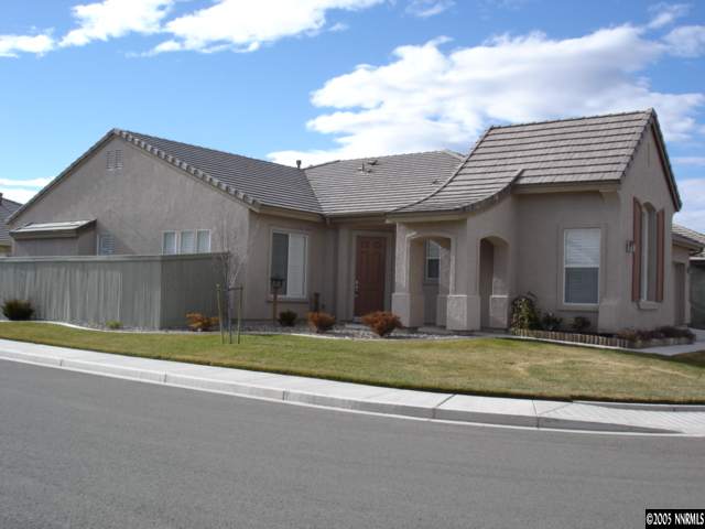 1698 Greycrest Way Reno, NV 89521 - Photo 1 of 6 a white house with a small yard and large trees