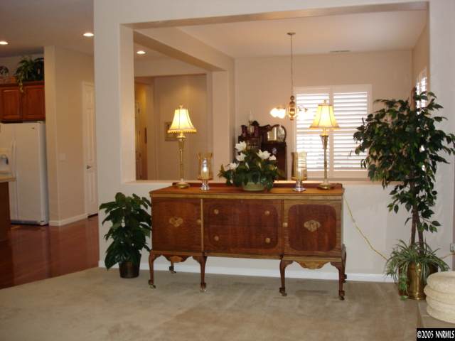 1698 Greycrest Way Reno, NV 89521 - Photo 2 of 6 a room with furniture and a potted plant