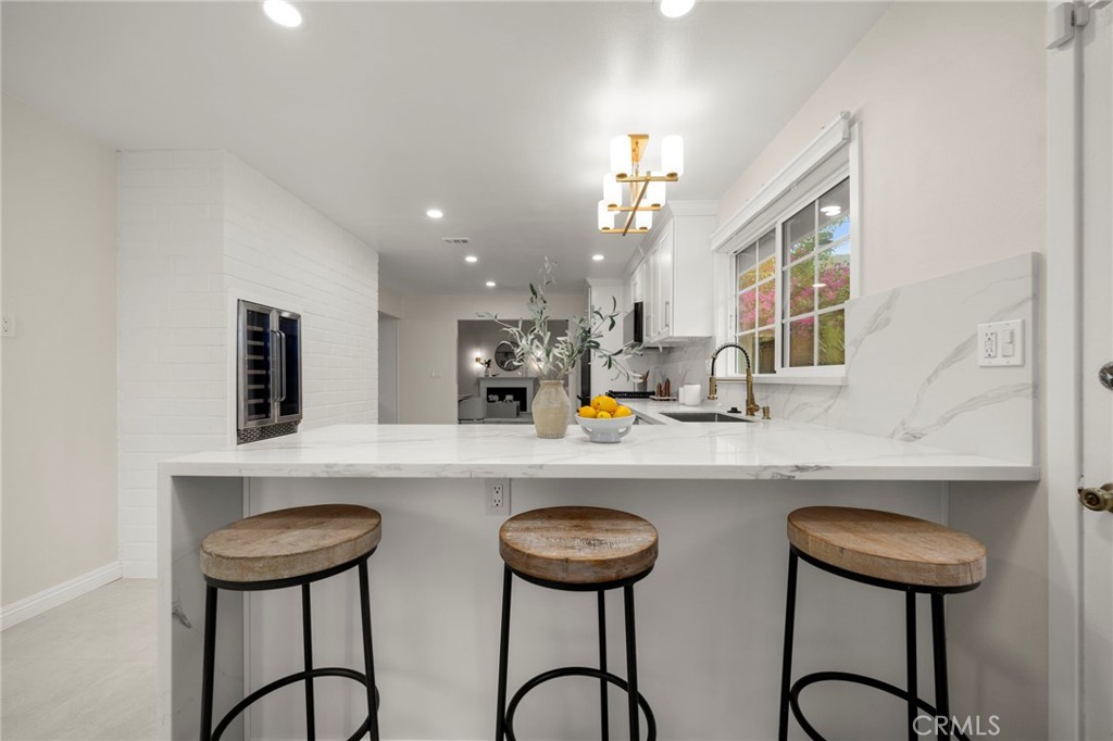 12817 Meadow Green Road La Mirada, CA 90638 - Photo 14 of 43 a kitchen with a table and chairs