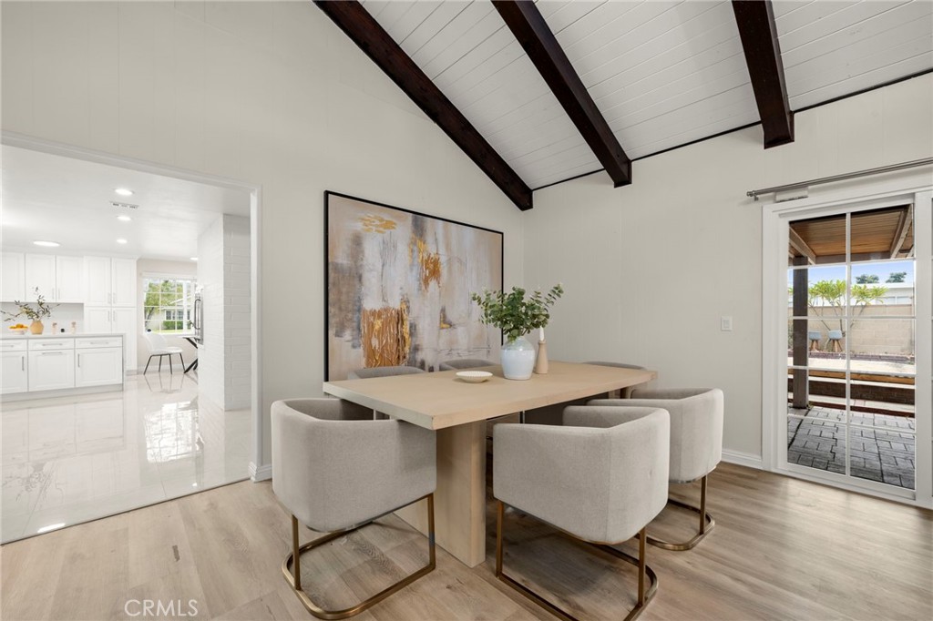 12817 Meadow Green Road La Mirada, CA 90638 - Photo 19 of 43 a view of a dining room with furniture and wooden floor
