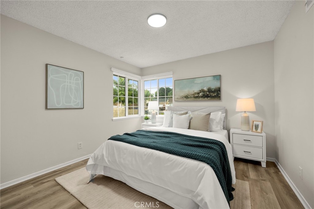 12817 Meadow Green Road La Mirada, CA 90638 - Photo 20 of 43 a bedroom with a bed and a window