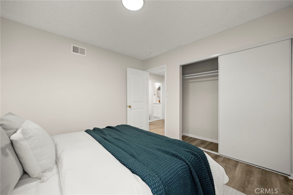 12817 Meadow Green Road La Mirada, CA 90638 - Photo 21 of 43 a bedroom with a bed and a couch