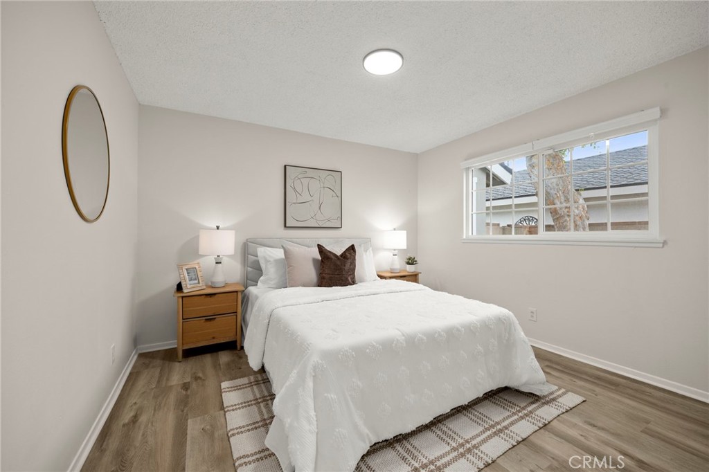 12817 Meadow Green Road La Mirada, CA 90638 - Photo 22 of 43 a bedroom with a bed and a window