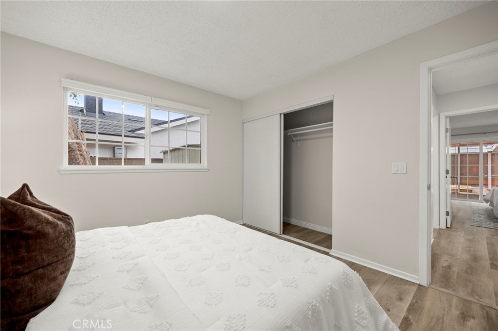 12817 Meadow Green Road La Mirada, CA 90638 - Photo 23 of 43 a bedroom with a bed and a window