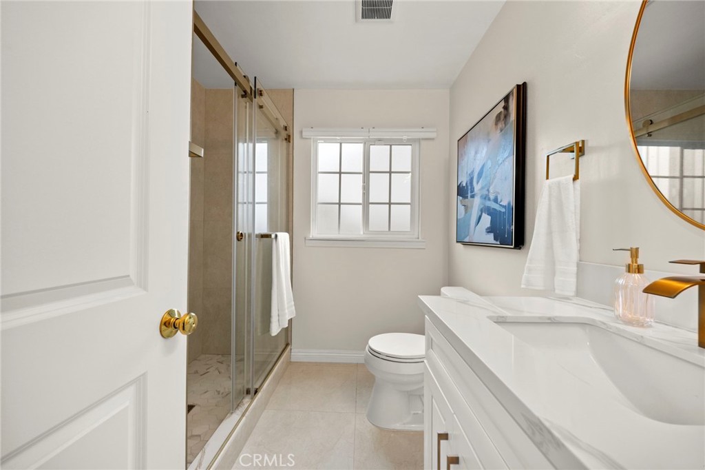 12817 Meadow Green Road La Mirada, CA 90638 - Photo 25 of 43 a bathroom with a sink toilet and shower