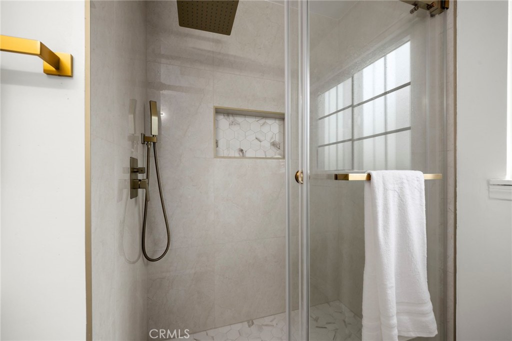 12817 Meadow Green Road La Mirada, CA 90638 - Photo 26 of 43 a bathroom with a shower