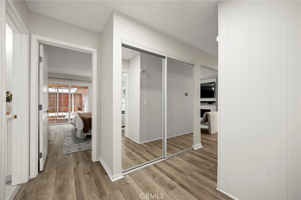 12817 Meadow Green Road La Mirada, CA 90638 - Photo 27 of 43 a view of a room with wooden floor and furniture