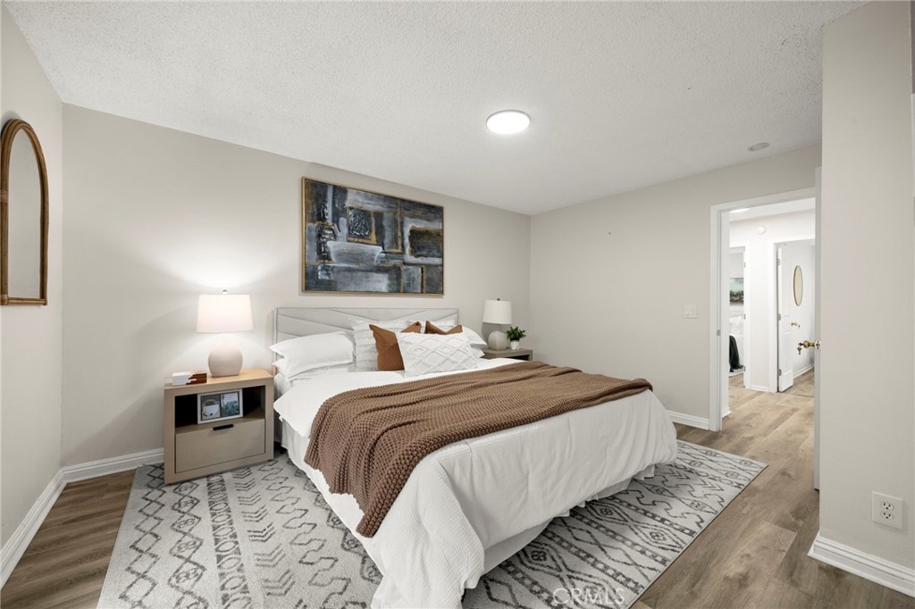 12817 Meadow Green Road La Mirada, CA 90638 - Photo 29 of 43 a bedroom with bed and a night stand