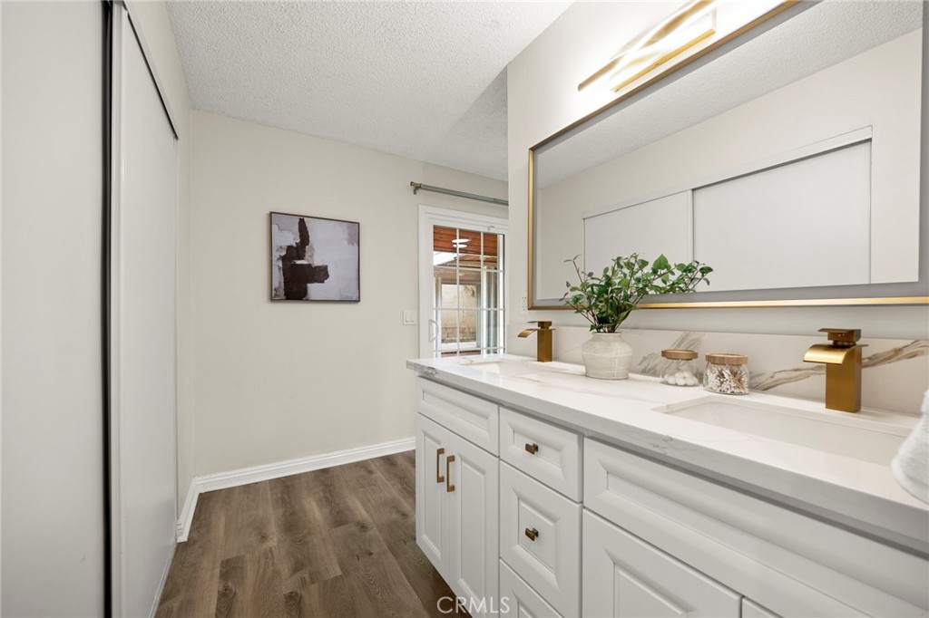 12817 Meadow Green Road La Mirada, CA 90638 - Photo 32 of 43 a bathroom with a sink and a mirror