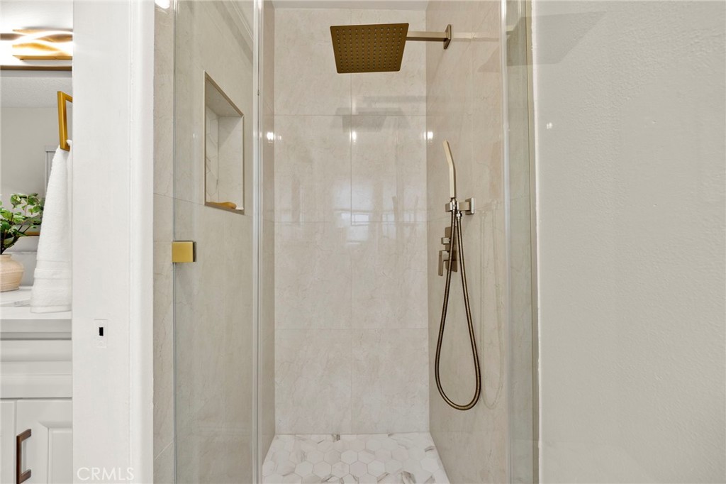 12817 Meadow Green Road La Mirada, CA 90638 - Photo 33 of 43 a bathroom with a shower