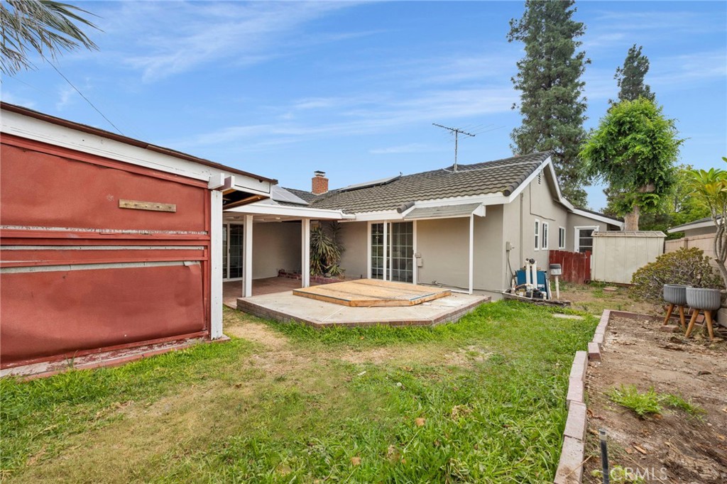 12817 Meadow Green Road La Mirada, CA 90638 - Photo 39 of 43 a front view of a house with a yard and garage