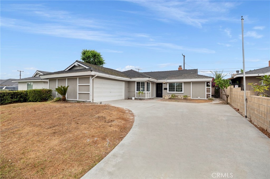 12817 Meadow Green Road La Mirada, CA 90638 - Photo 42 of 43 a front view of a house with a porch