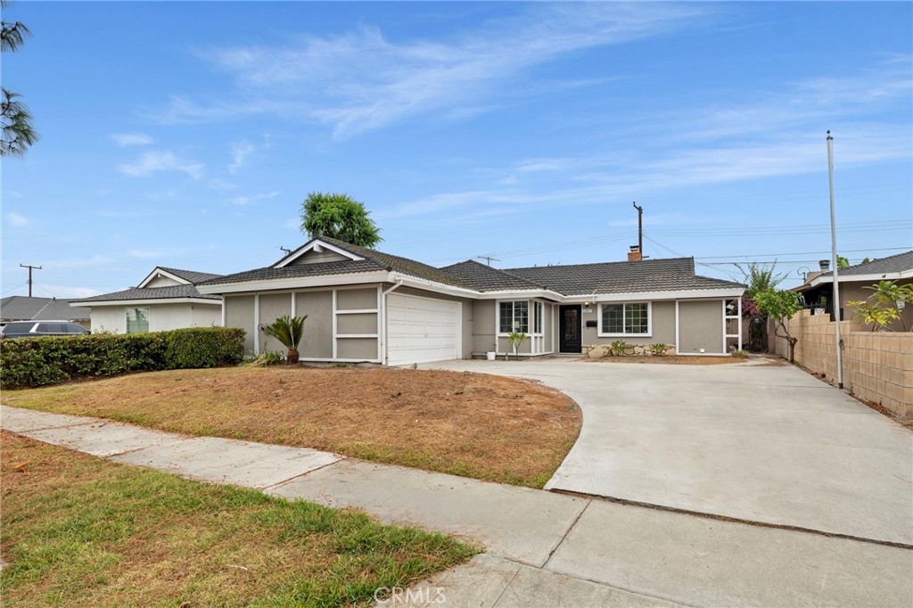 12817 Meadow Green Road La Mirada, CA 90638 - Photo 43 of 43 a front view of a house with yard