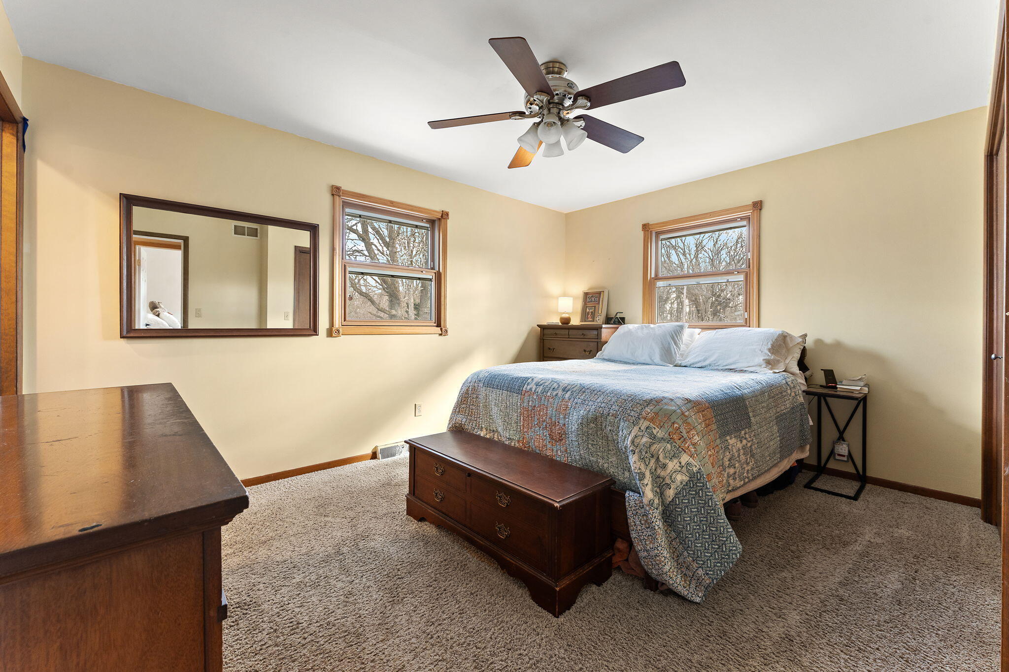 3910 West 106th Lane Crown Point, IN 46307 - Photo 16 of 31 a spacious bedroom with a bed and a desk