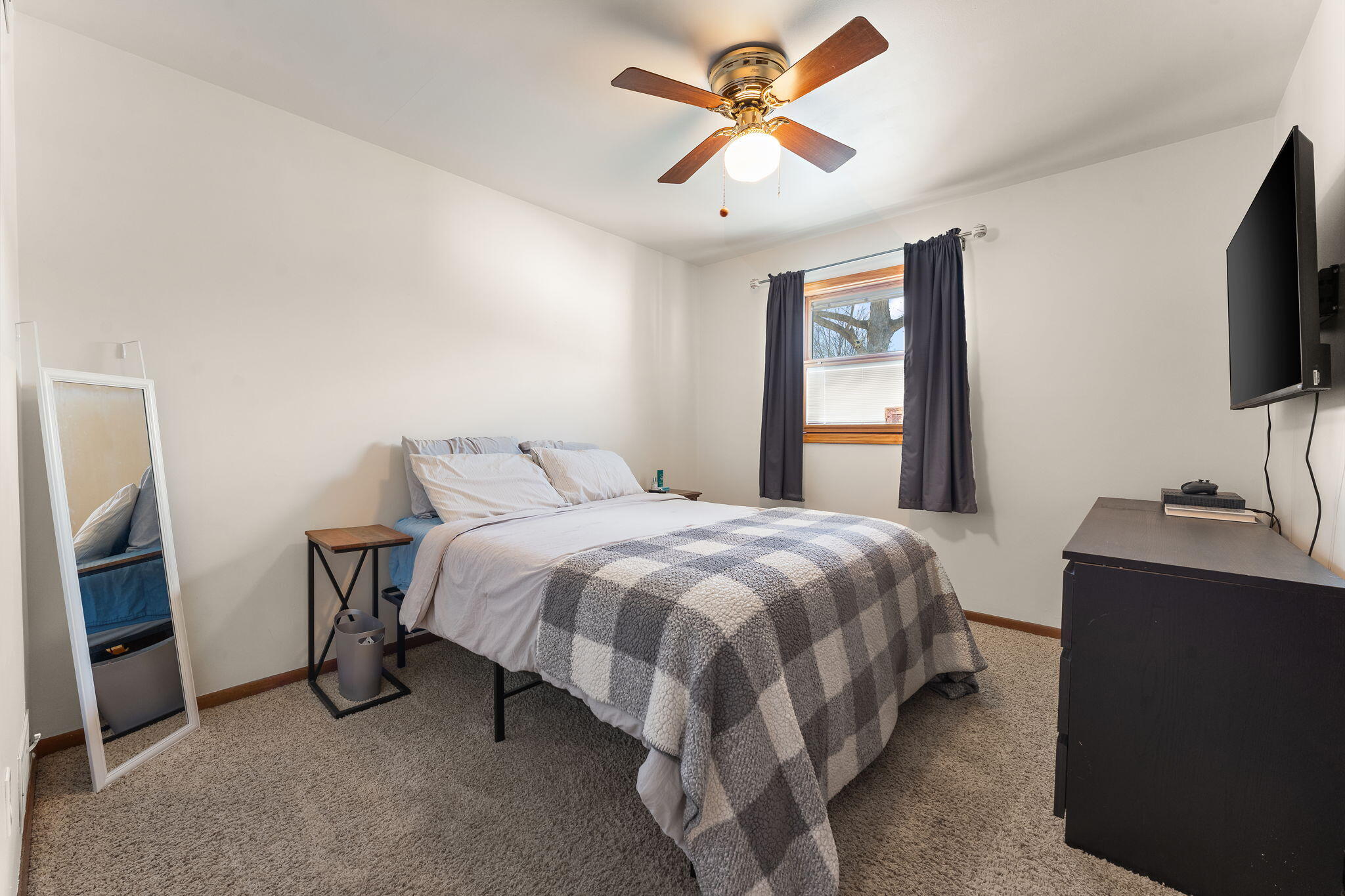 3910 West 106th Lane Crown Point, IN 46307 - Photo 20 of 31 a spacious bedroom with a bed and a flat screen tv