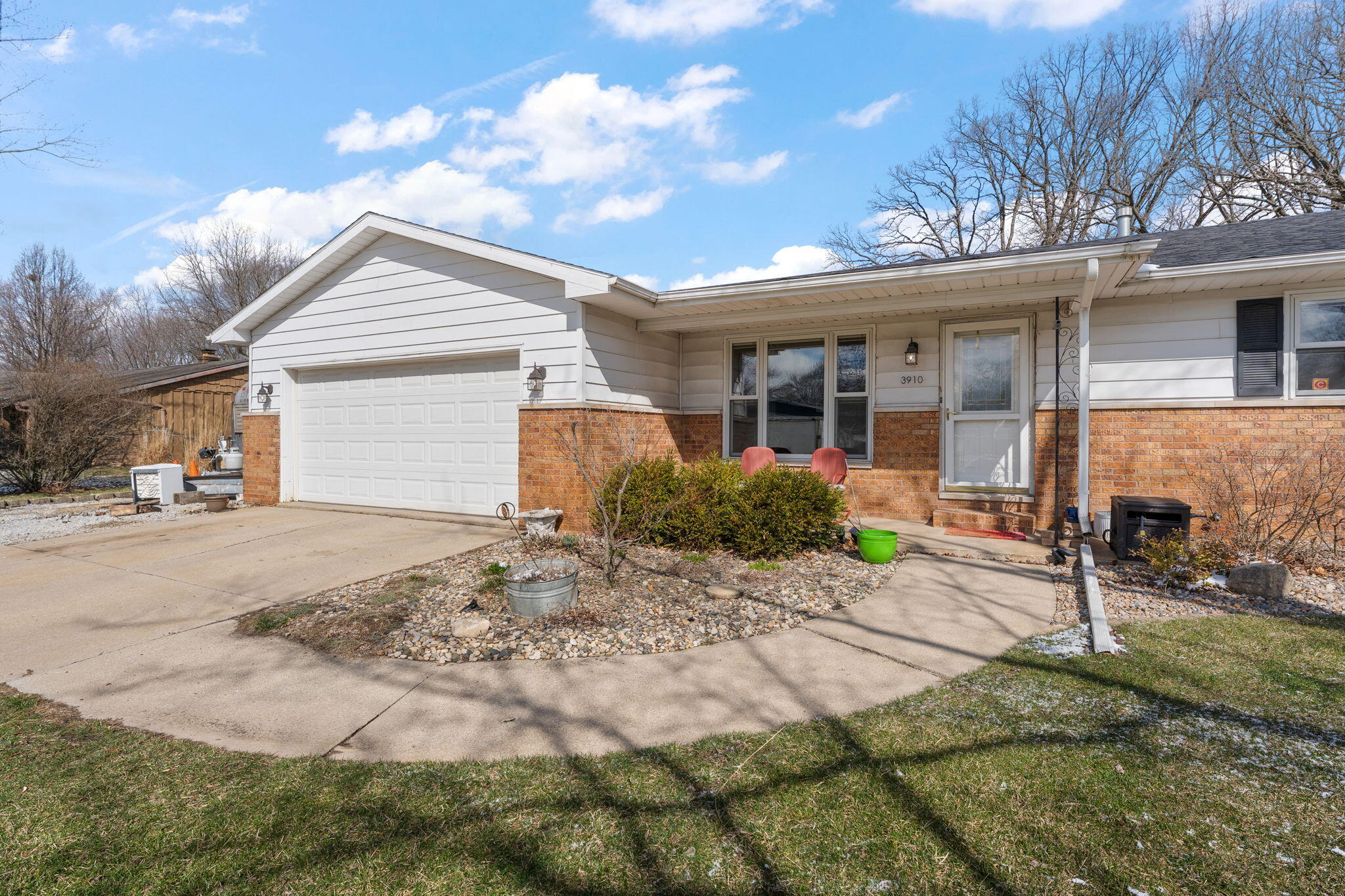 3910 West 106th Lane Crown Point, IN 46307 - Photo 2 of 31 a front view of a house with garden