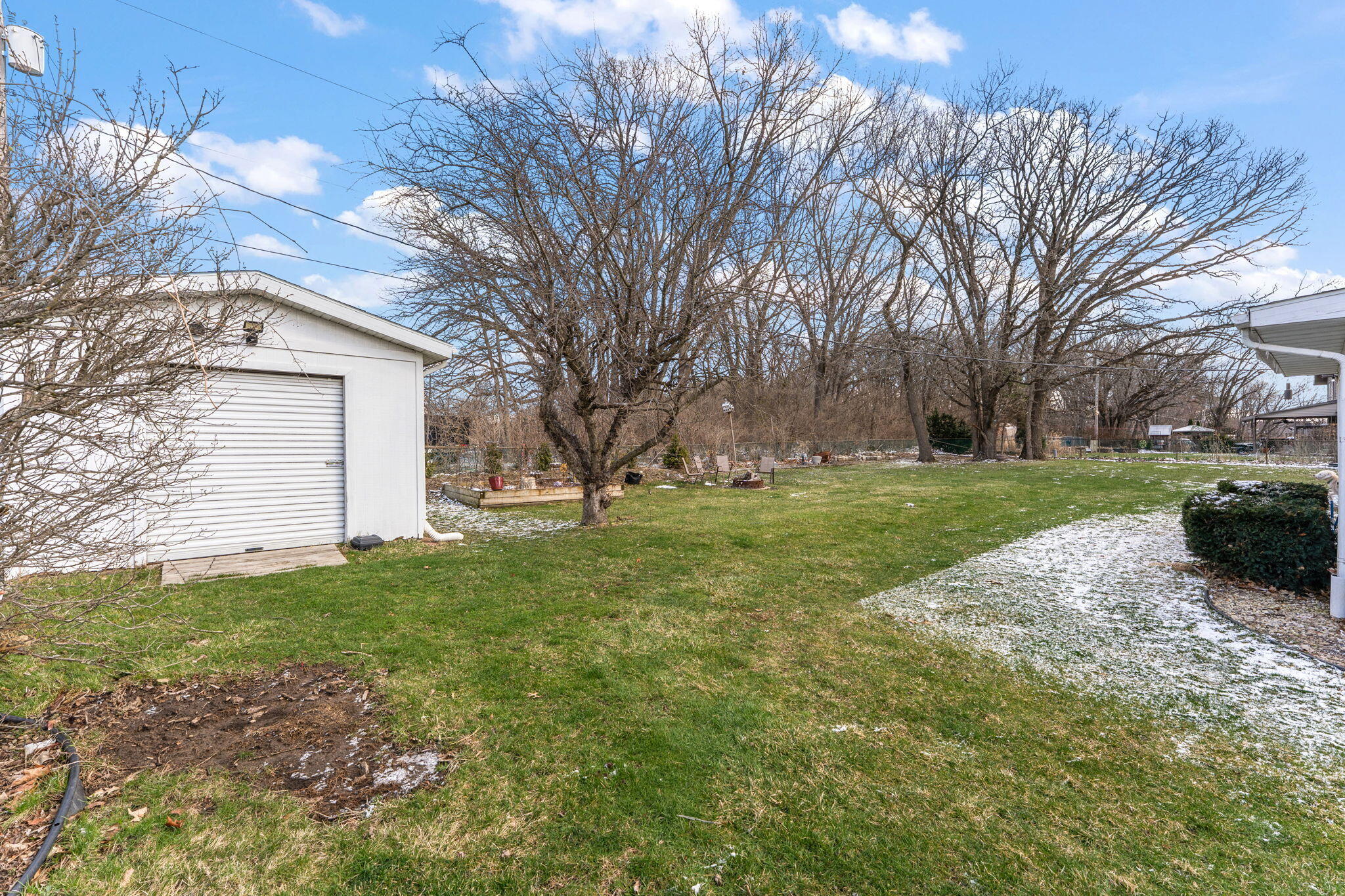 3910 West 106th Lane Crown Point, IN 46307 - Photo 28 of 31 a view of a backyard with large trees