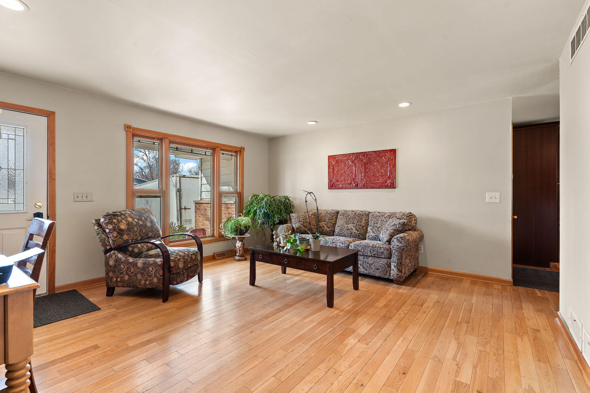3910 West 106th Lane Crown Point, IN 46307 - Photo 4 of 31 a living room with furniture and wooden floor