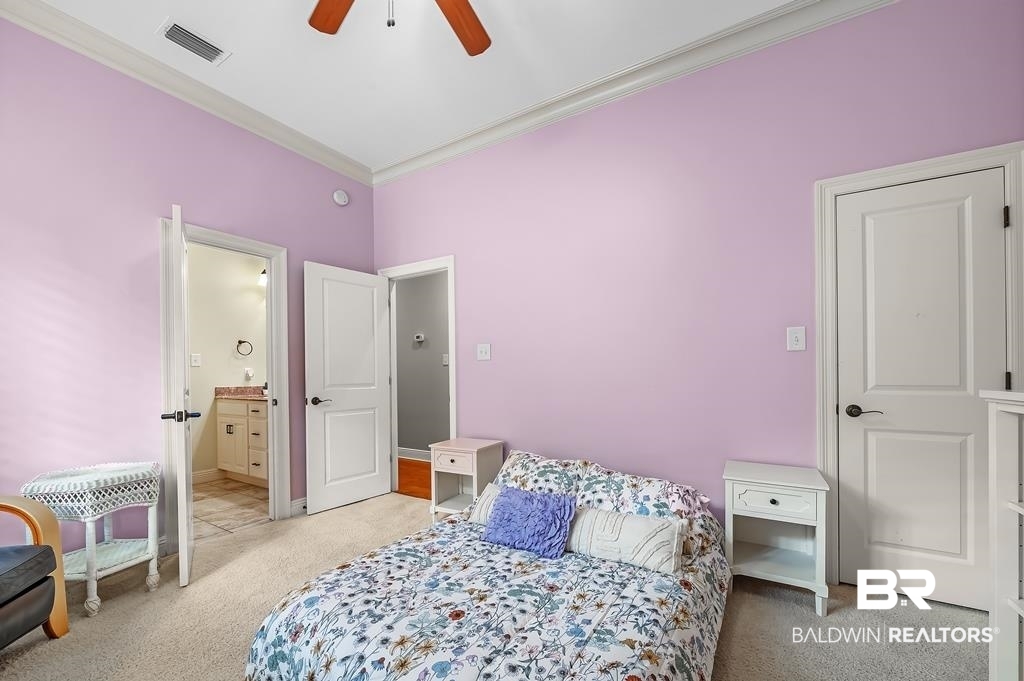 30014 Dolive Ridge Daphne, AL 36527 - Photo 43 of 57 Carpeted bedroom with ceiling fan, ensuite bathroom, and ornamental molding