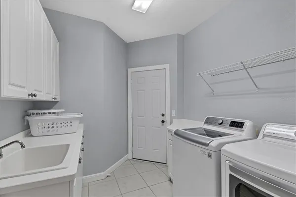a utility room with dryer and washer