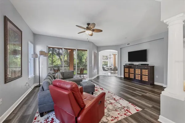 a living room with furniture fireplace and a flat screen tv