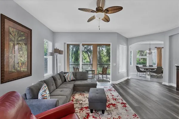 a living room with furniture and a large window
