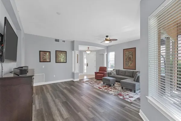 a living room with furniture and a flat screen tv