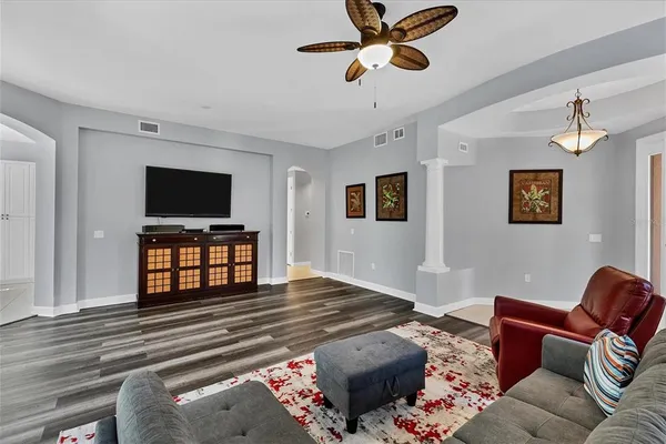 a living room with furniture and a flat screen tv