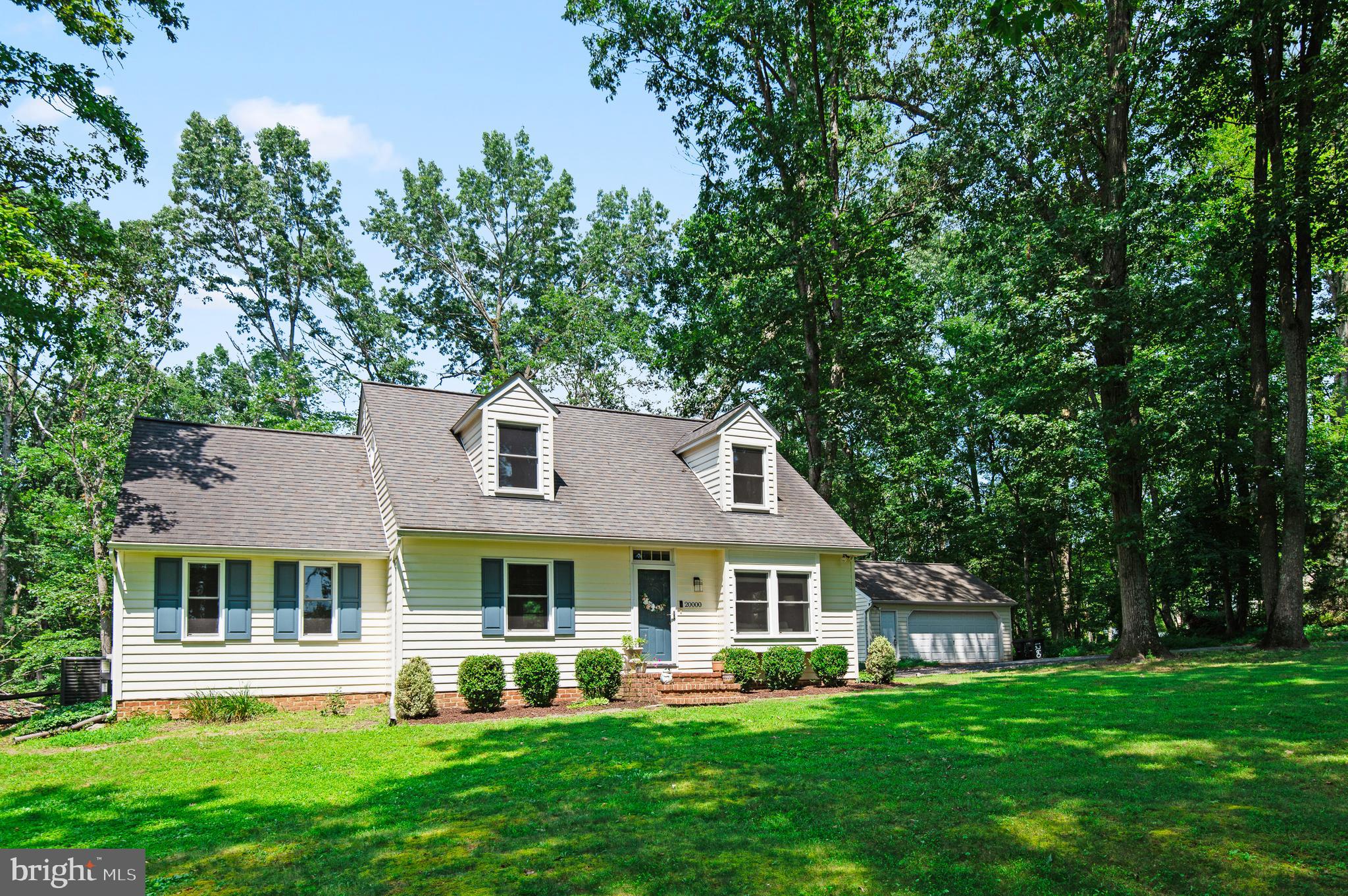 20000 Cameron Mill Road Parkton, MD 21120 - Photo 1 of 57 a front view of a house with a yard and trees