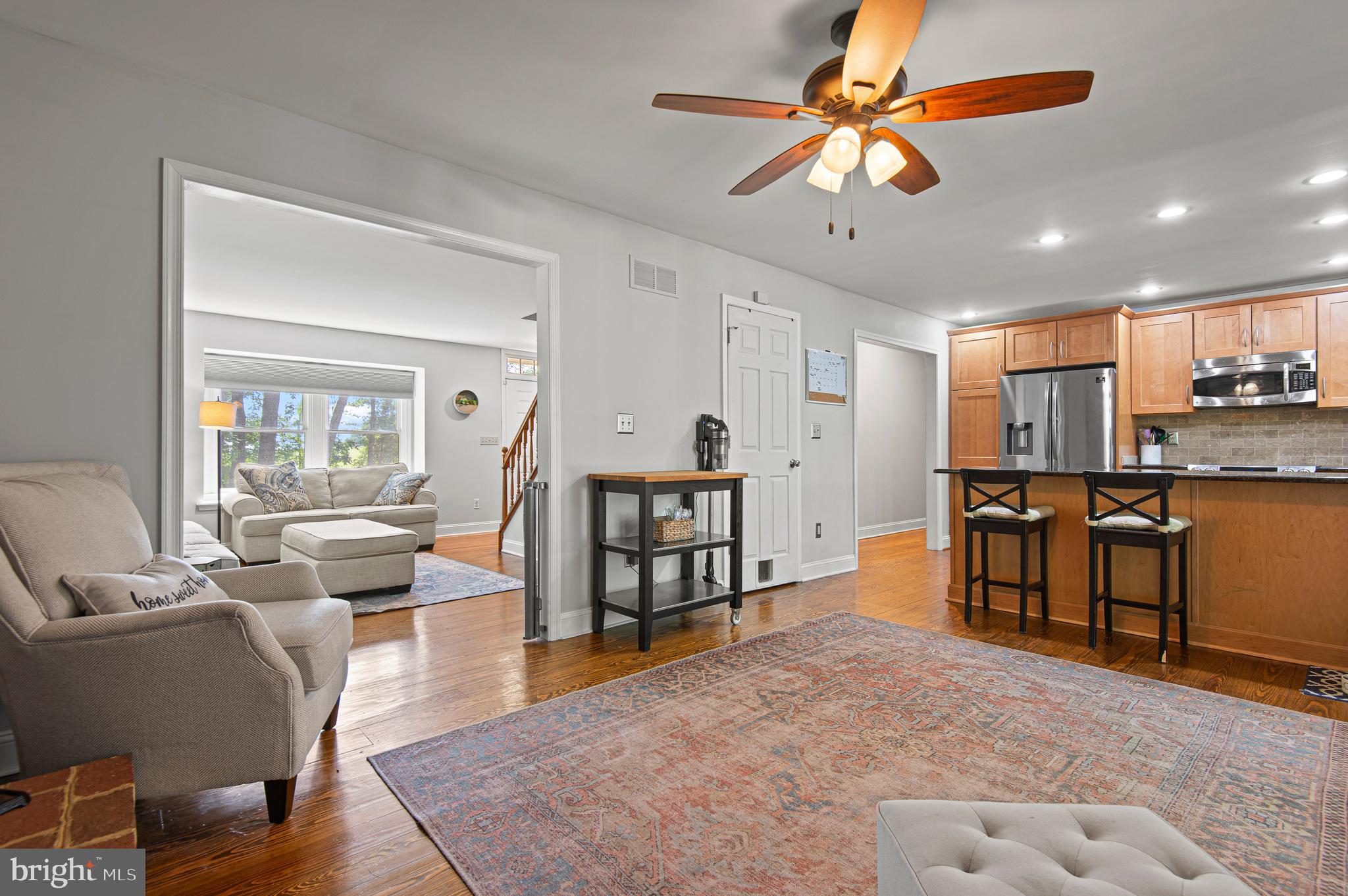 20000 Cameron Mill Road Parkton, MD 21120 - Photo 11 of 57 a living room with stainless steel appliances lots of furniture and a chandelier