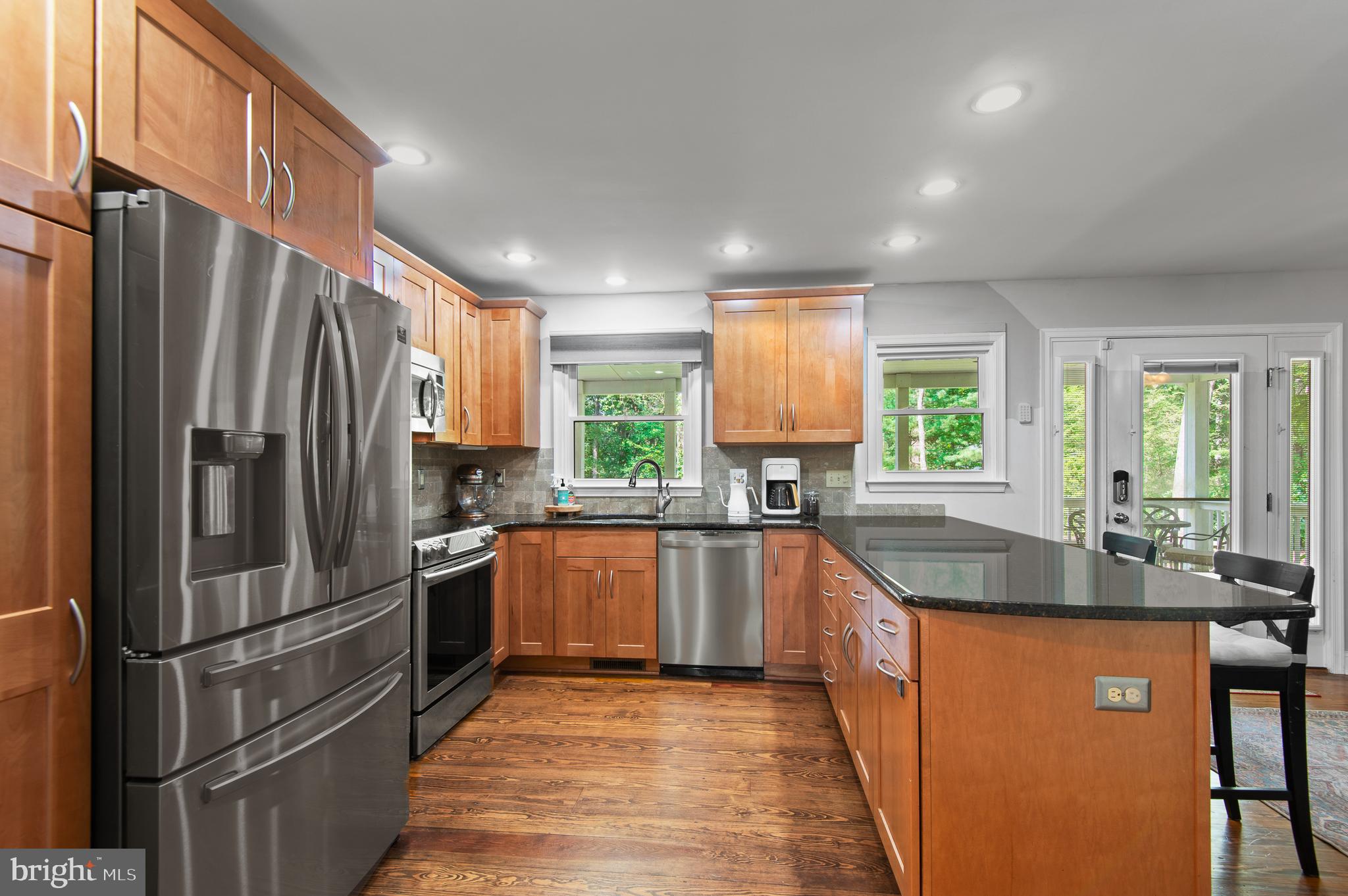 20000 Cameron Mill Road Parkton, MD 21120 - Photo 14 of 57 a kitchen with stainless steel appliances granite countertop a refrigerator a sink a stove and island