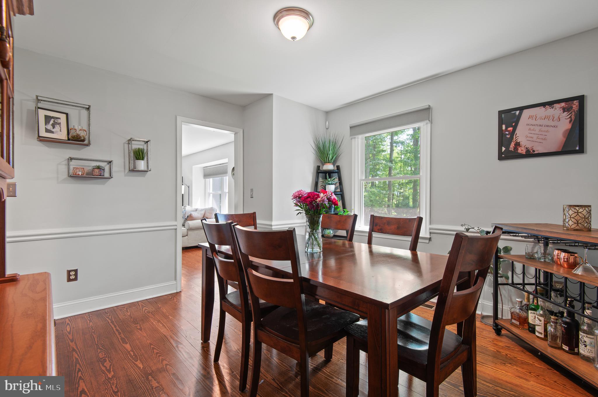 20000 Cameron Mill Road Parkton, MD 21120 - Photo 17 of 57 a view of a dining room with furniture and wooden floor