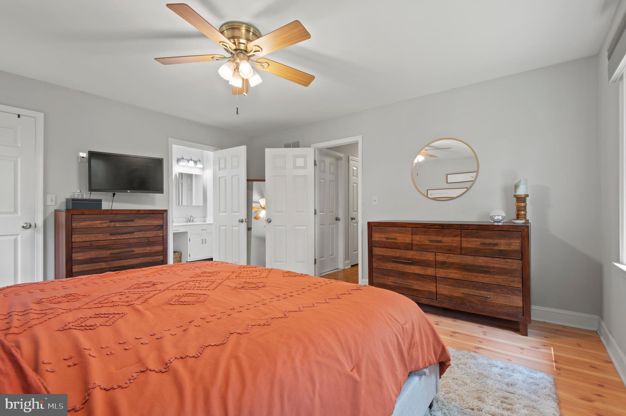 20000 Cameron Mill Road Parkton, MD 21120 - Photo 19 of 57 a bedroom with a bed and a chandelier